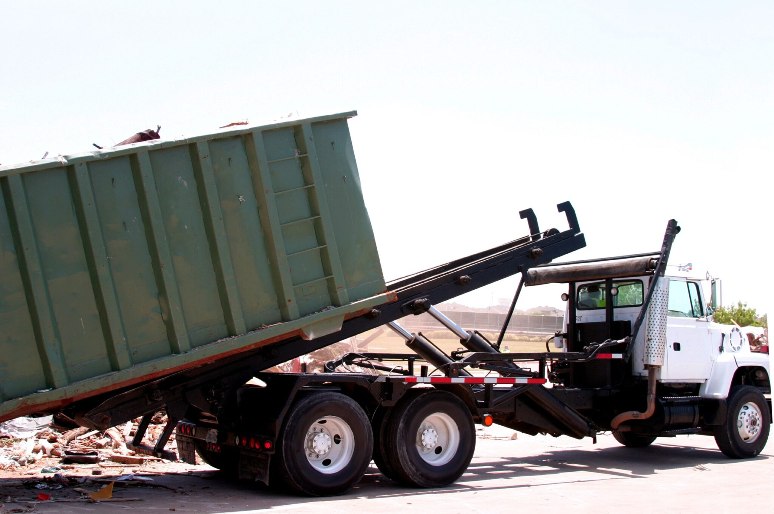 Truck unloading debris