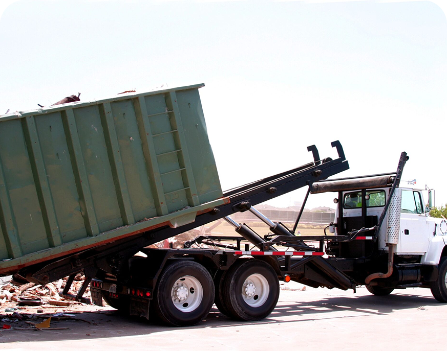 Dumpster being emptied by truck