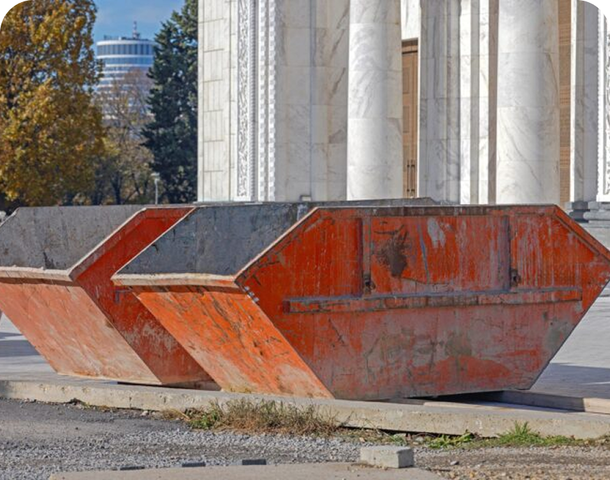 Rusty dumpsters in urban setting