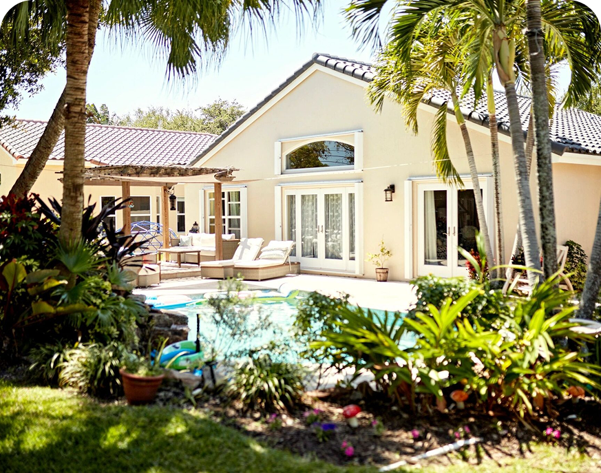 Tropical backyard with pool and patio